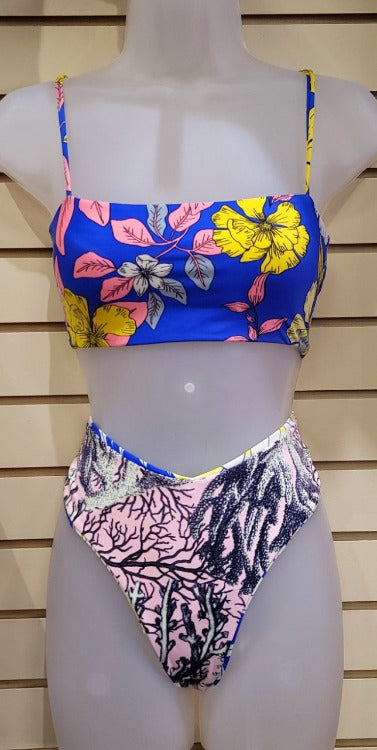 Make a statement (and waves!) at the beach with this Maaji Lorelei Atrium Bikini Set. With its strappy bralette top that features removable pads, a tie-back closure, and reversible design for a fun surprise, you can show off your style while keeping your peace of mind. The high-rise bottoms with mild seat coverage make this cheeky suit the one and only you need for summer!