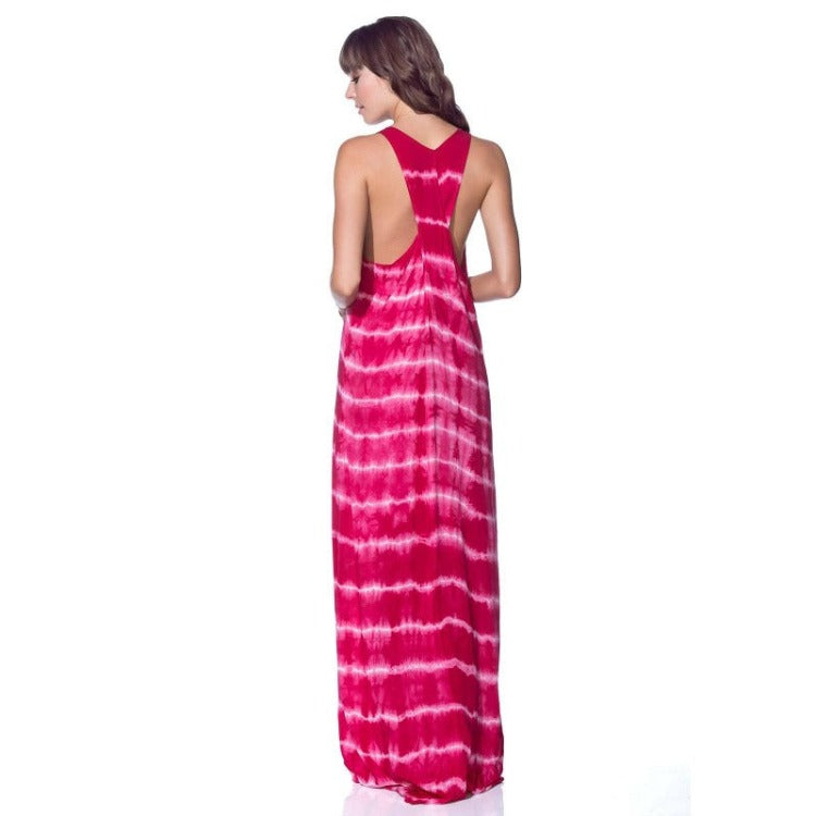 This Maaji Stop and Listen Maxi Dress Cover Up is the coolest way to make a splash -- featuring a tie-dye pattern, cross over back straps, and a knee-length front slit, it's got all the vibes colombians could ever want! Plus, it's totally 100% Viscose, so it's soft and comfy to boot.