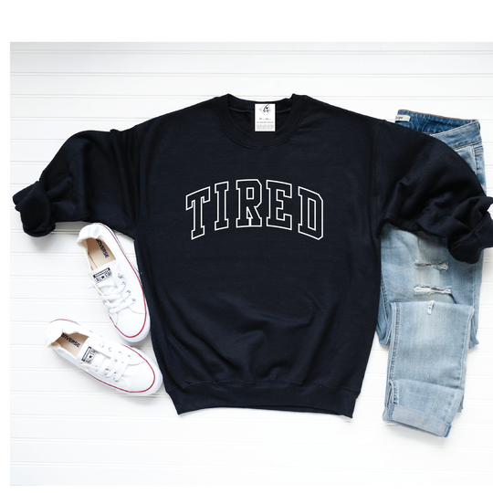 Feel the "tired," be the "tired"! Our Blonde Ambition 'Tired' Crew Neck Sweater is the perfect way to share your relatable vibes with the world. Show 'em who's boss with this cozy sweater that literally tells it like it is. Get it, girl!