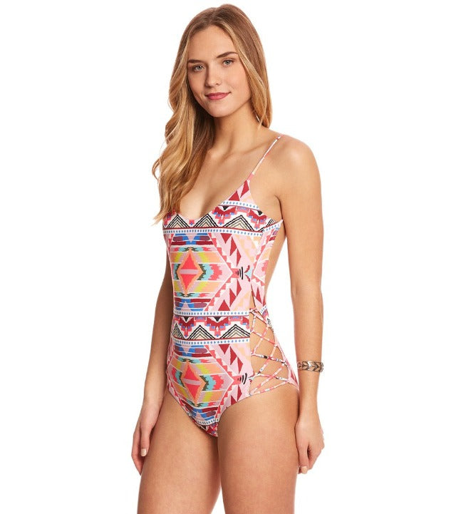 Experience a blast from the past with our Tribe Time One Piece! This vintage-inspired swimsuit has an allover tribal print, a unique open back design, and a chic crisscross detail at the hips. And let's not forget this beauty is complete with an embroidered Billabong logo and cheeky bottom coverage. Ready to explore the wild side of style? Dive in!