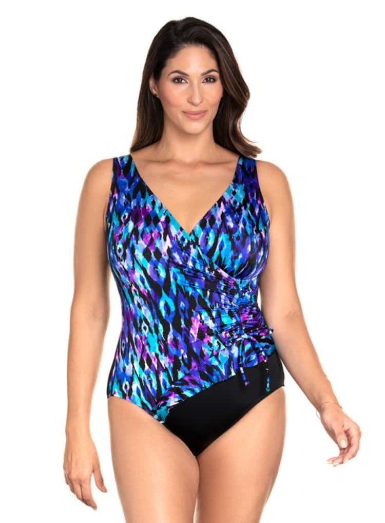 Slip into the Tulum Ruffle One Piece and feel the luxurious soft cup bra nestled comfortably against your skin. This gorgeous one piece features a chic V-Neckline, fixed straps, and a scoop back. Show off your curves with a moderate leg cut, perfect for a day in the sun or a night by the pool! Who says you can't have it all?